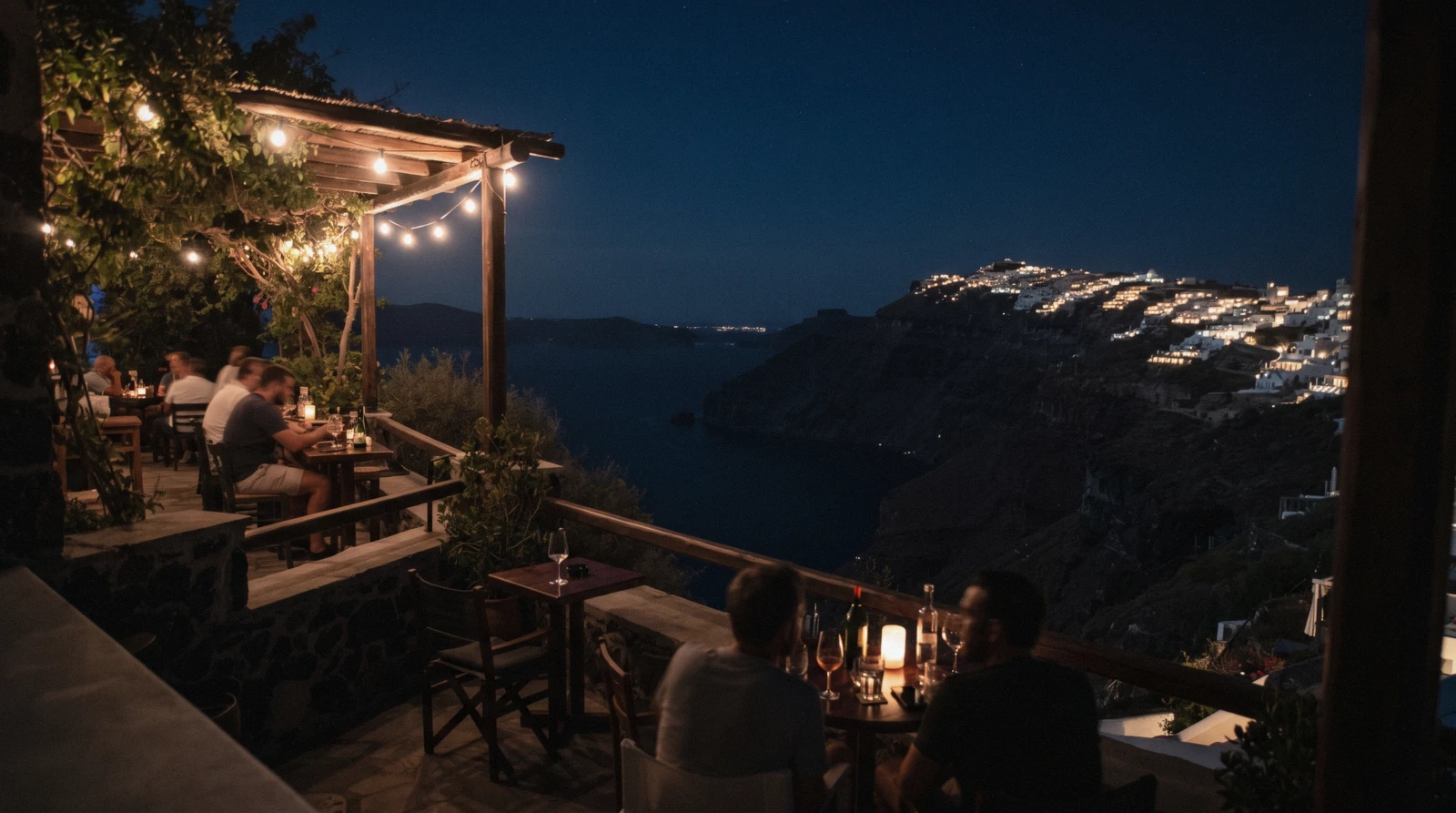 A small cocktail bar terrace on the caldera edge in Fira at 21:00, santorini nightlife, Santorini Greece