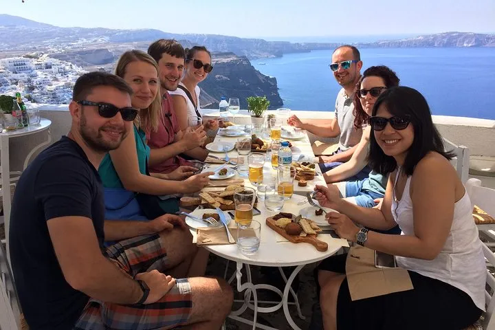 Plates of fava and tomato fritters on a Fira walking food tour, Santorini Greece