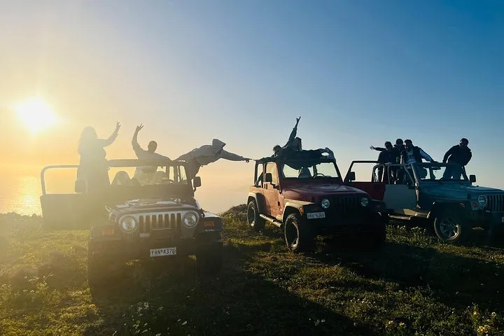 Jeep convoy on a ridge road on a Santorini Wrangler jeep sunset tour, Santorini Greece