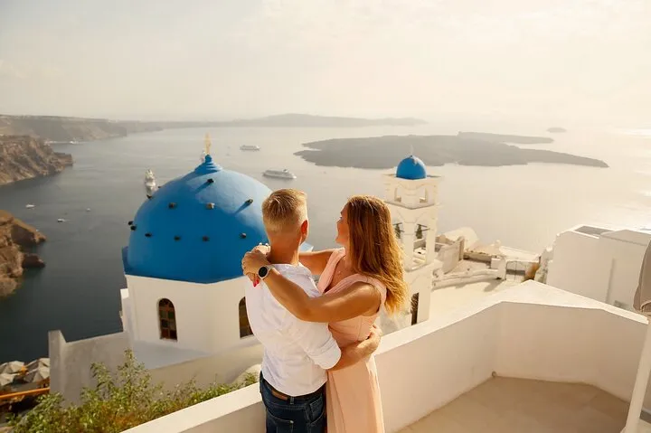 Candid photo on a caldera terrace with a vacation photographer in Santorini, Santorini Greece