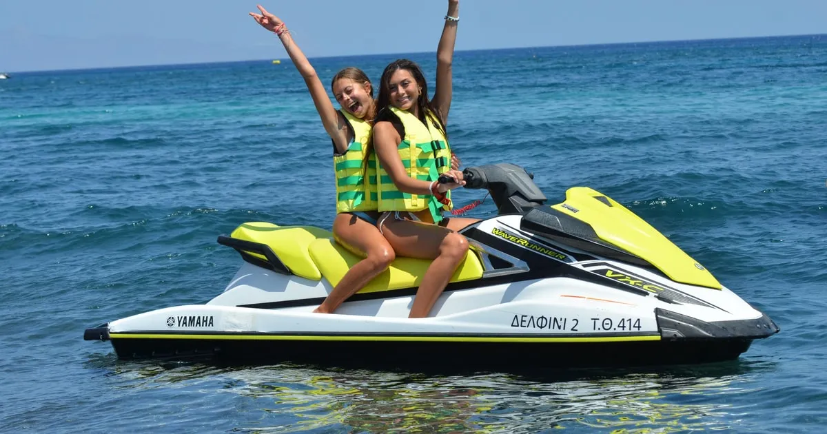 Jet ski on the water off Perissa black beach, Santorini Greece